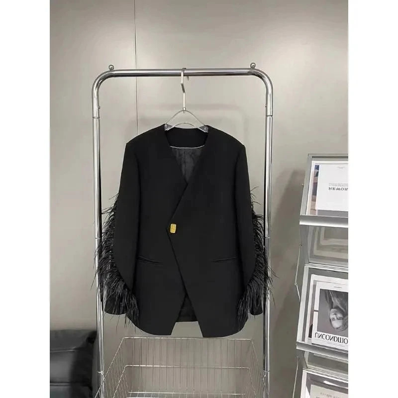 Blazer long avec détails plumes